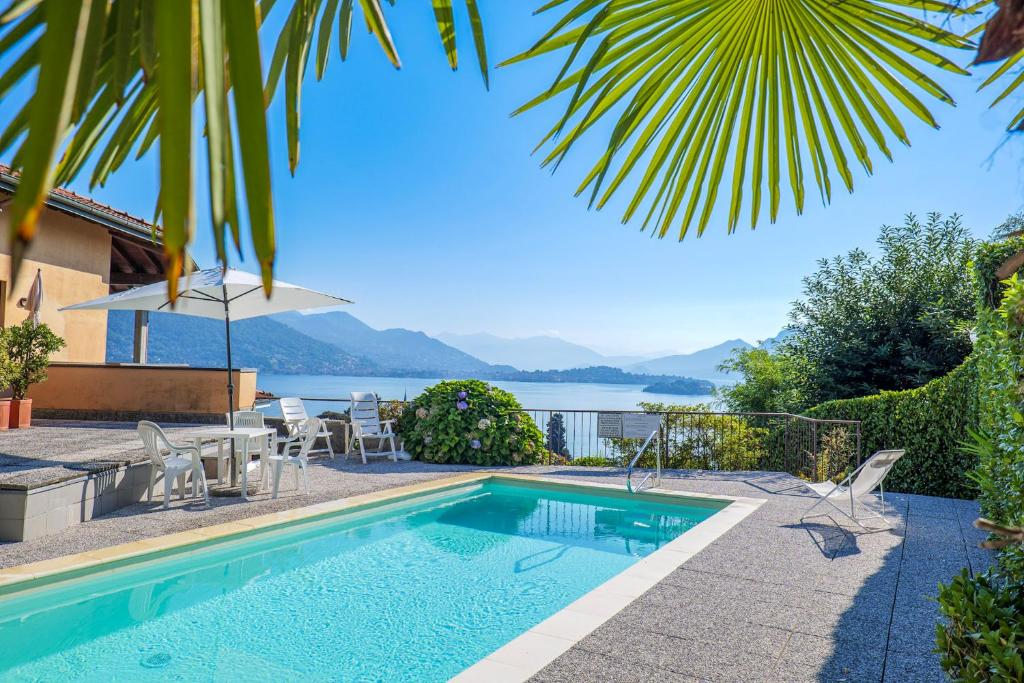 a swimming pool with a view of the water at Residenz Vogino in Baveno