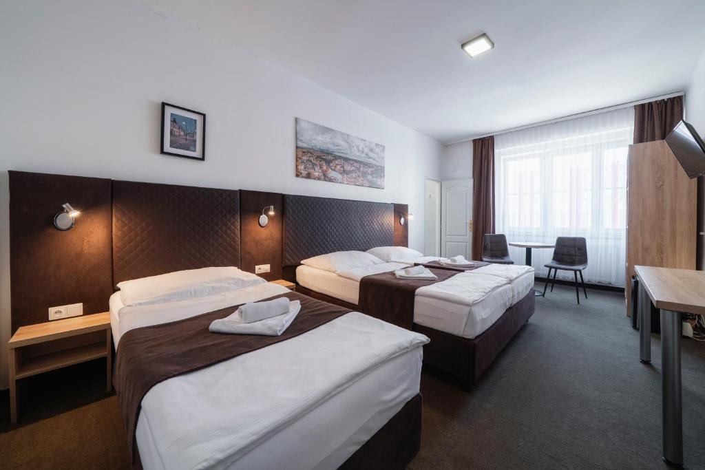 Penzion Homér Slaný - Dreibettzimmer