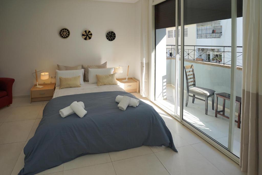 Ένα ή περισσότερα κρεβάτια σε δωμάτιο στο Luxury Fes Apartment - ALHAMBRA Suites