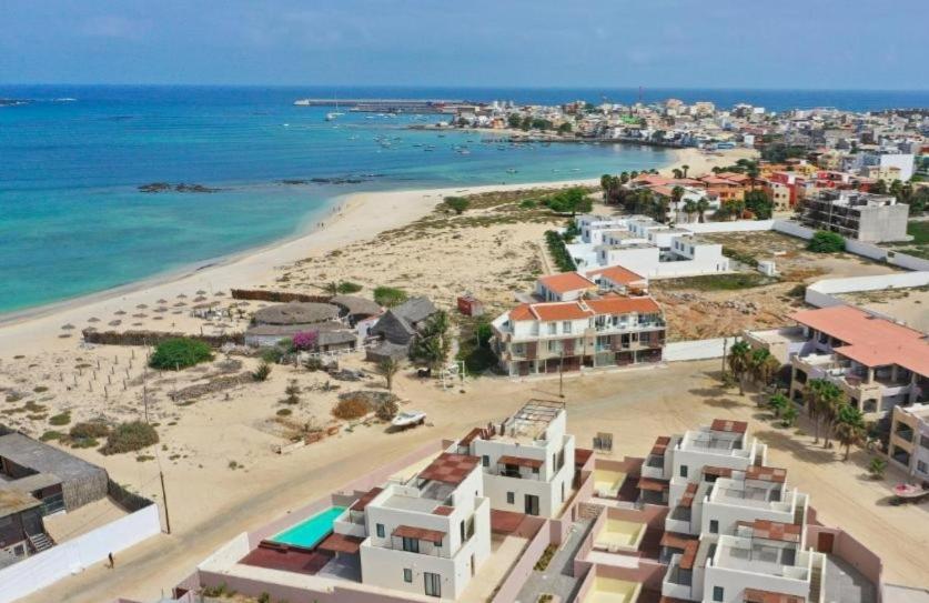an aerial view of a beach with buildings and the ocean at Beach Villa ,Lagoon ,Estoril - Sol y MAR in Sal Rei