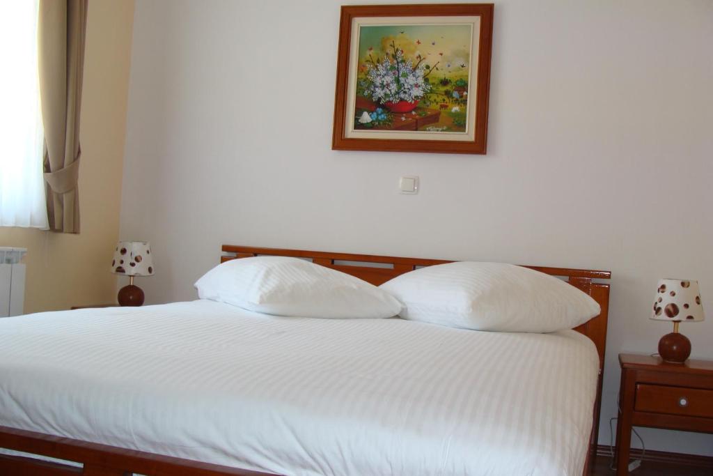 Postel nebo postele na pokoji v ubytování Apartmani Maltar