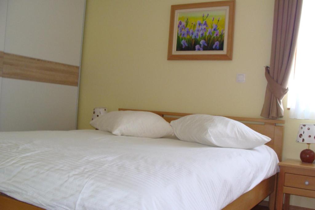 Postel nebo postele na pokoji v ubytování Apartmani Maltar