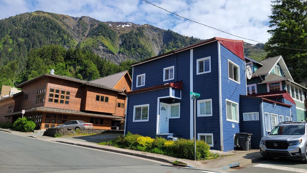 a blue house on the side of a street at Downtown Juneau Gold Street Apartments in Juneau