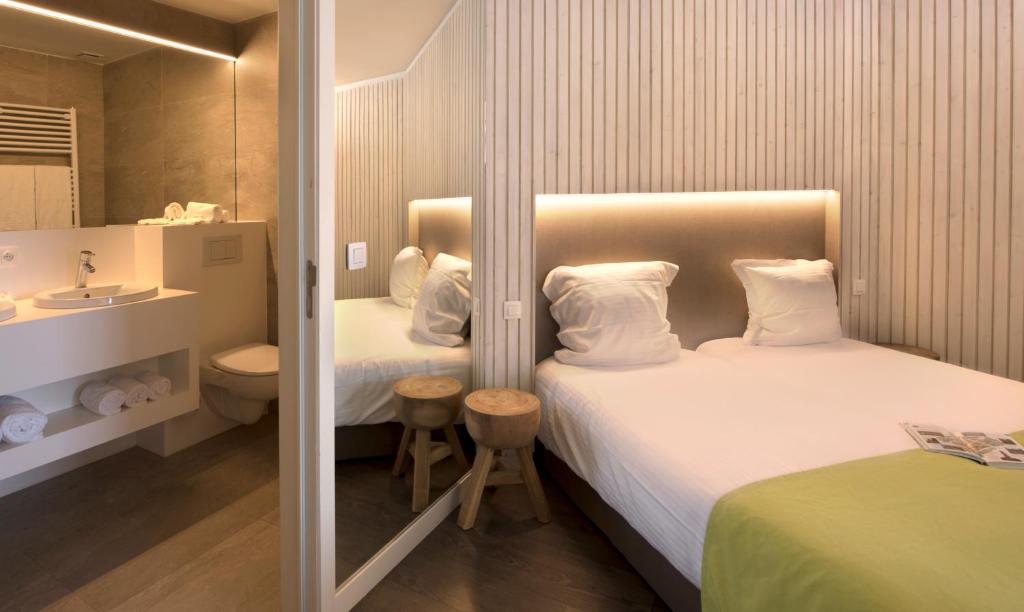 Postel nebo postele na pokoji v ubytování Flanders Hotel