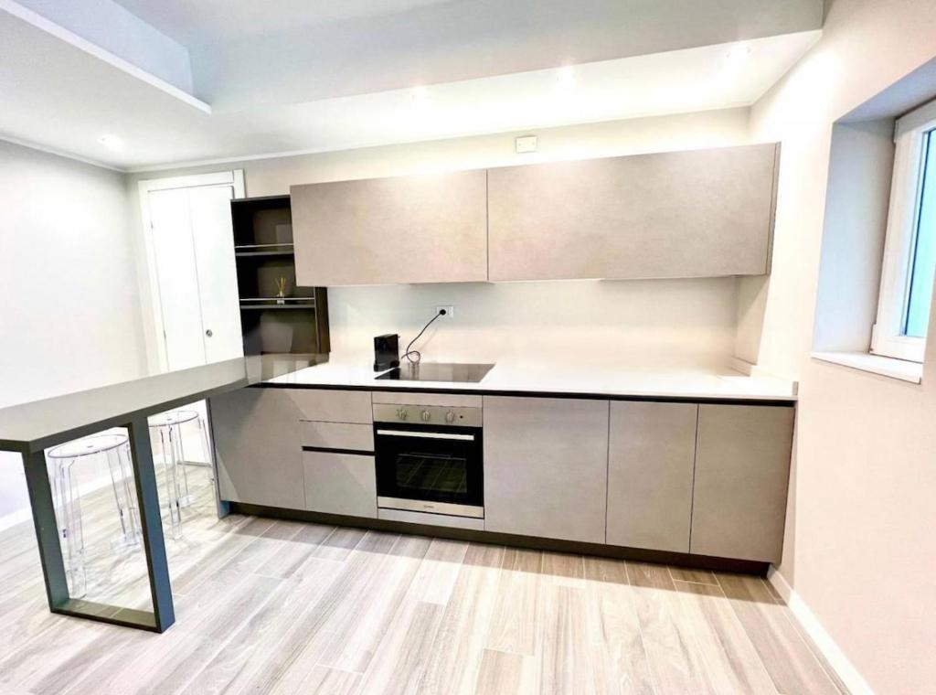 a kitchen with a sink and a stove at ApartBergamo in Bergamo