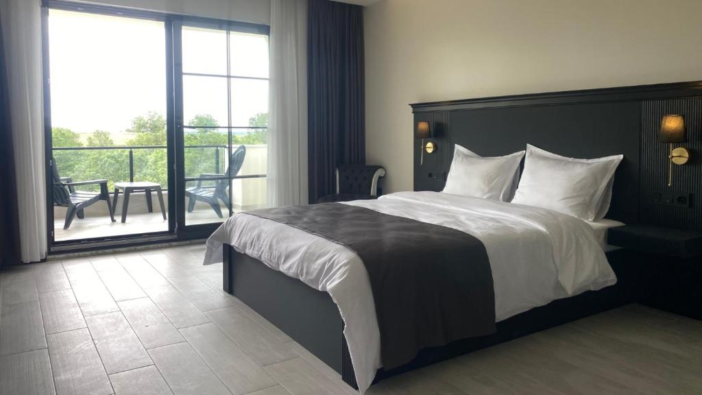 Ένα ή περισσότερα κρεβάτια σε δωμάτιο στο The Reference Club Country Resort & Restaurant Lüleburgaz