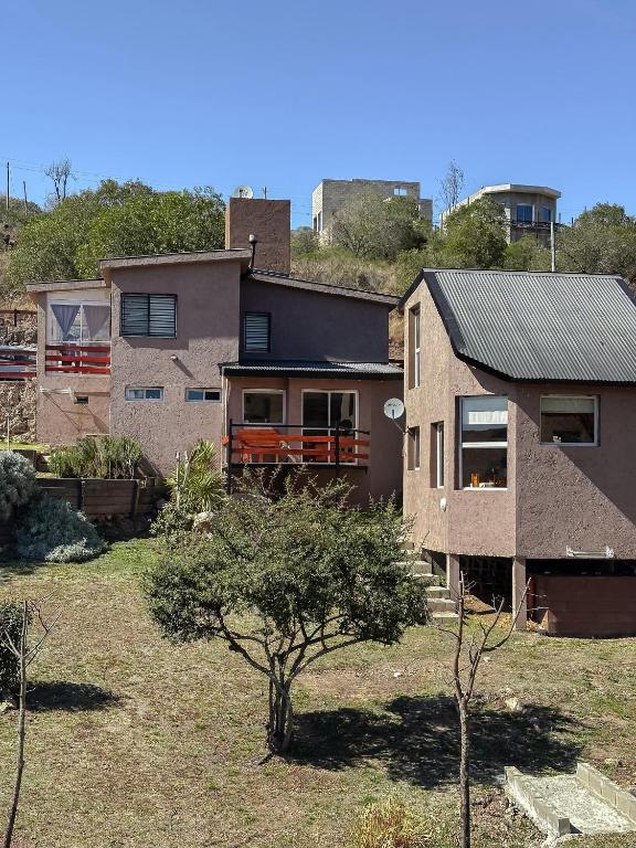 a house that is sitting in a yard at El Refugio in Córdoba