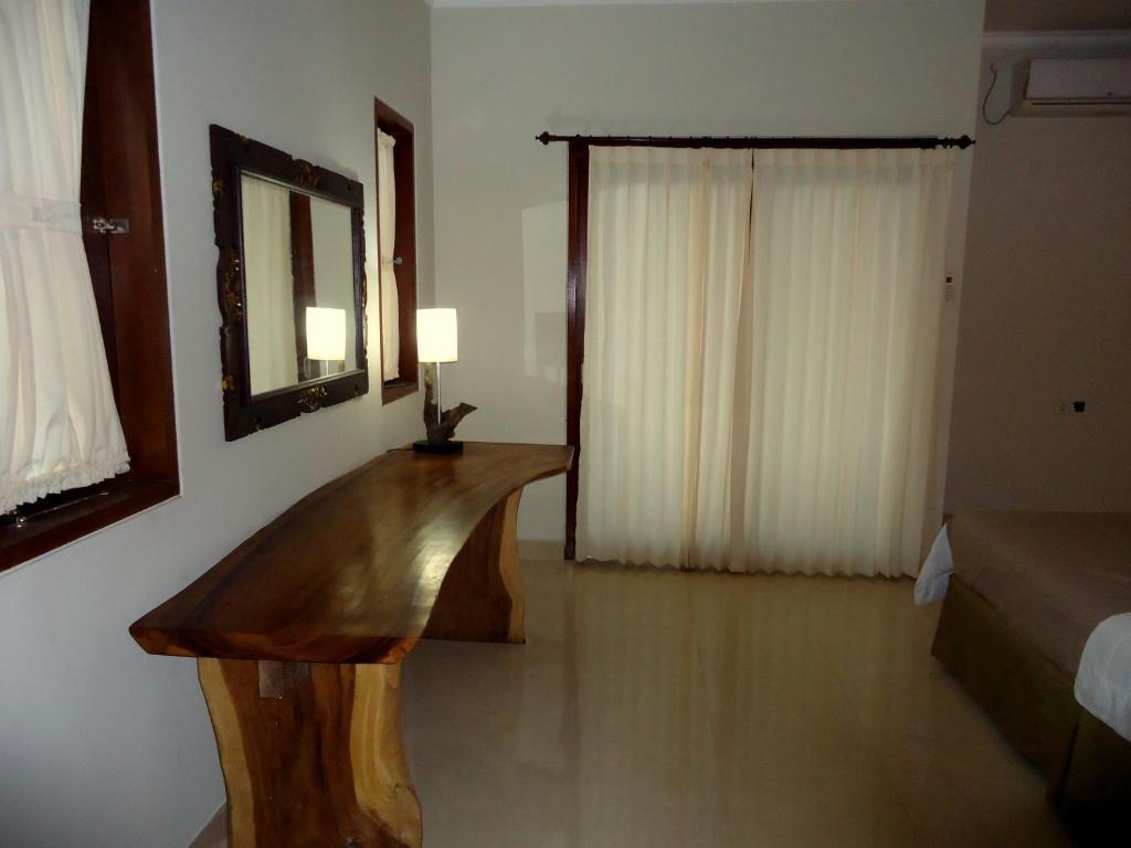 Postel nebo postele na pokoji v ubytování Dewa Put Guest House
