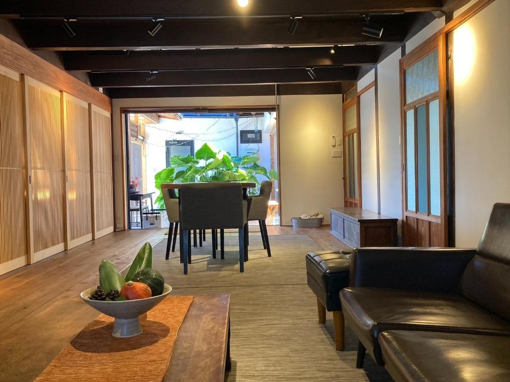 a living room with a couch and a table at Suehiroya - Vacation STAY 60087v in Nakatsu