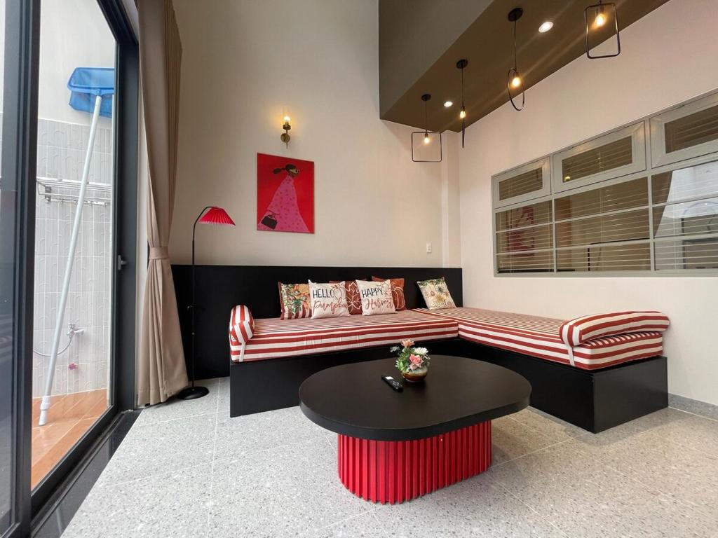 a living room with a couch and a table at SUNNY villa by the beach-Private Pool-3 bedrooms in Nha Trang