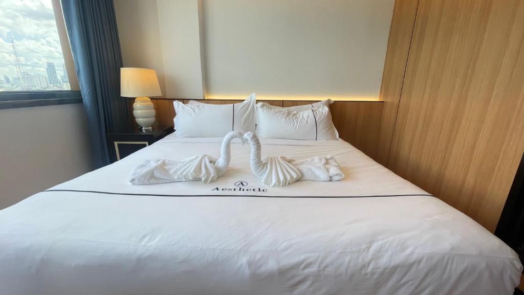 Ένα ή περισσότερα κρεβάτια σε δωμάτιο στο Aesthetic Hotel