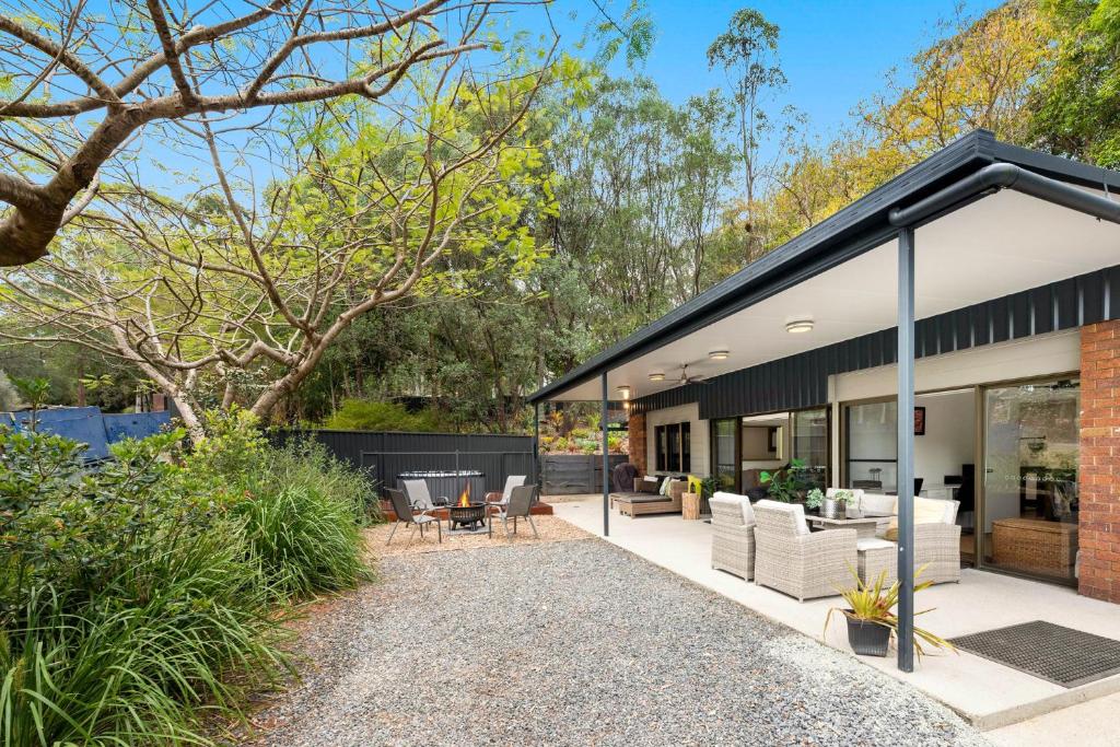 an extension to a house with a black roof at Anembo Country Cottages in Eatons Hill