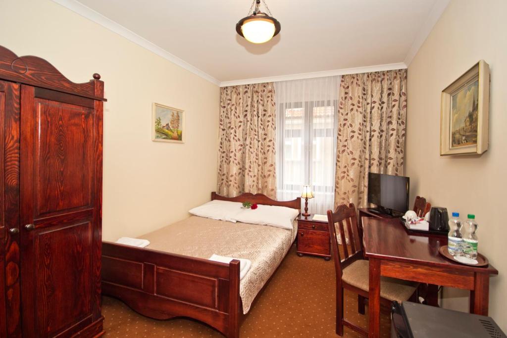Postel nebo postele na pokoji v ubytování Hotel Retman