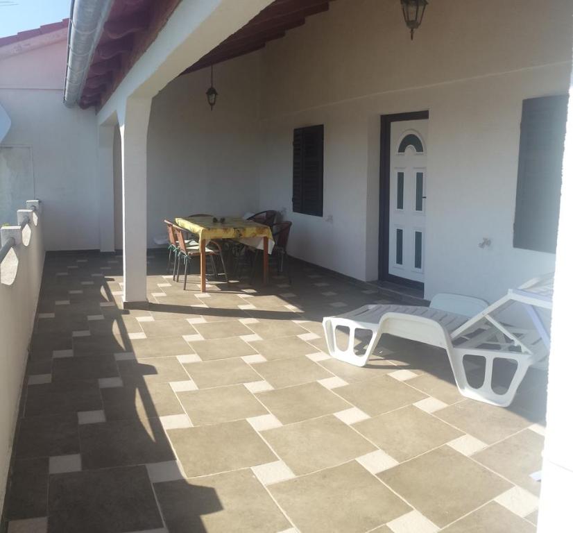 a living room with a table and a patio at Apartments Antica in Šimuni