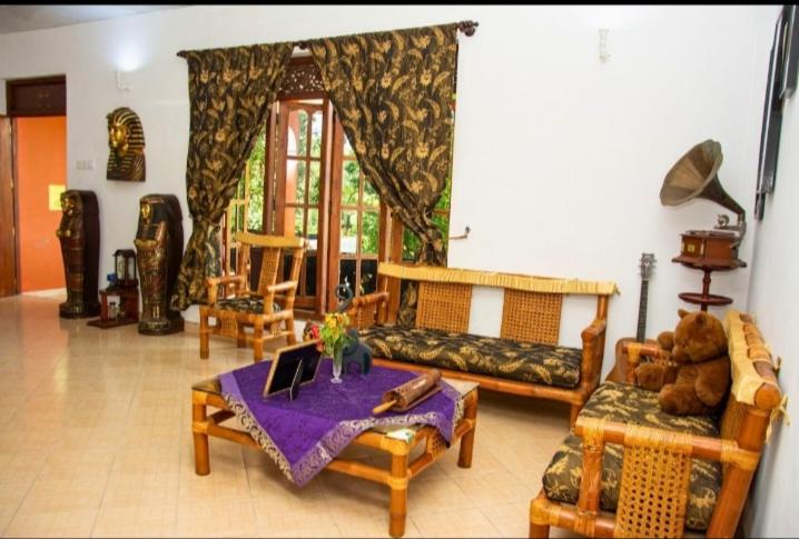 a living room with a couch and a table at The Kingston Court in Kandy