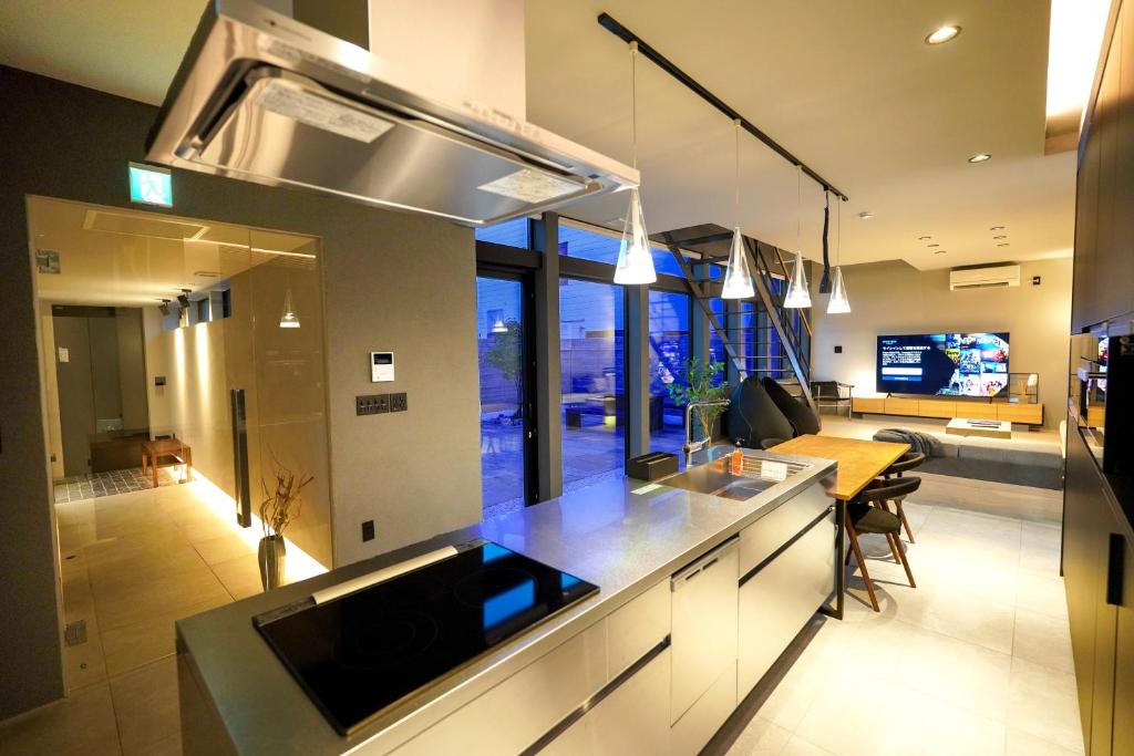 a kitchen with a sink and a counter top at amairo Villa in Asahikawa