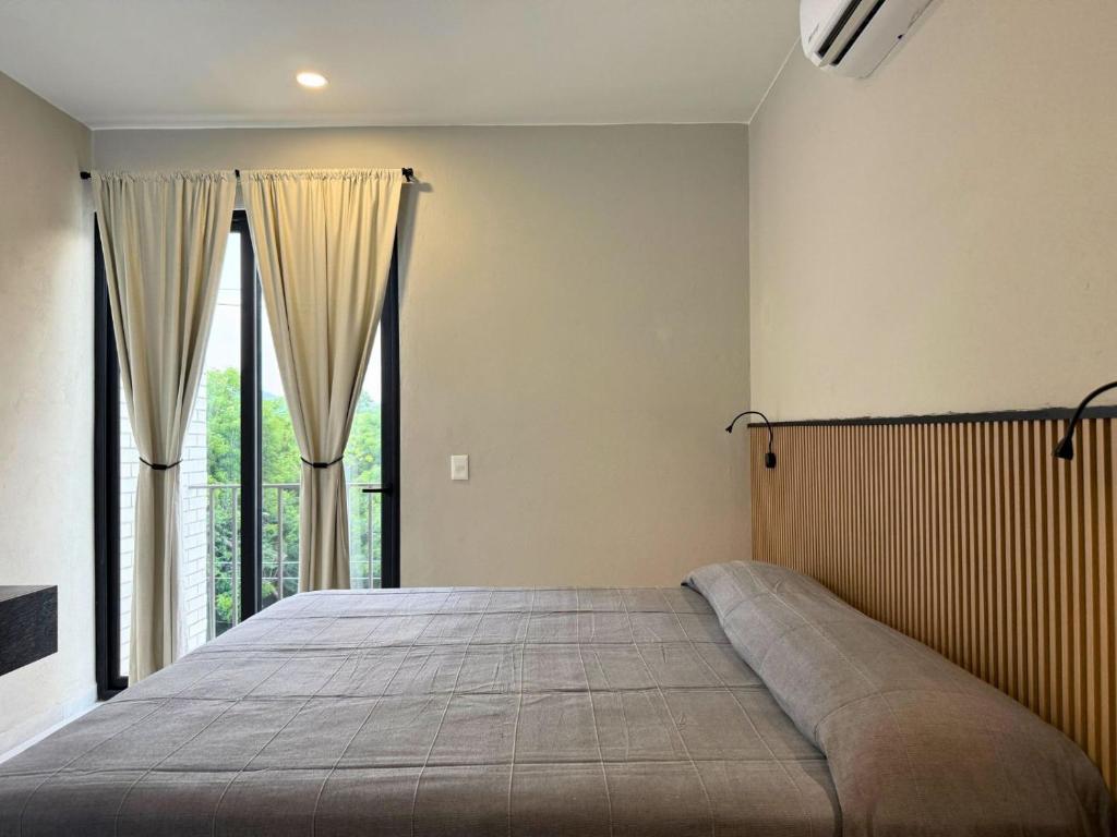Ένα ή περισσότερα κρεβάτια σε δωμάτιο στο Rooms Sector M