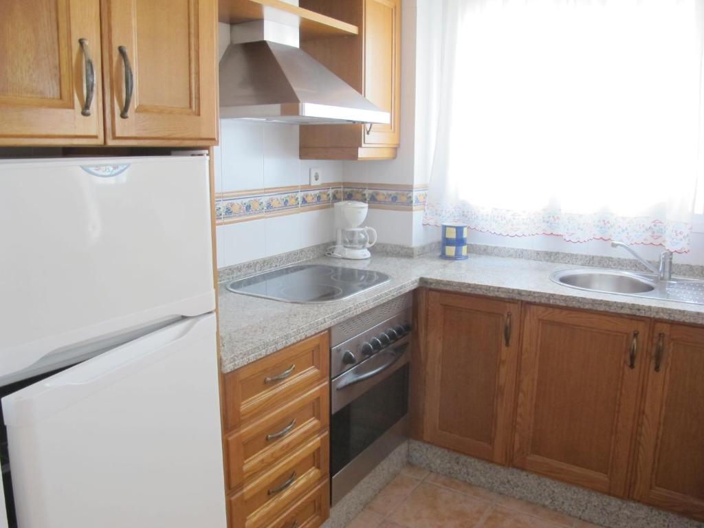 Kuchyňa alebo kuchynka v ubytovaní Apartamentos Jimmy 2