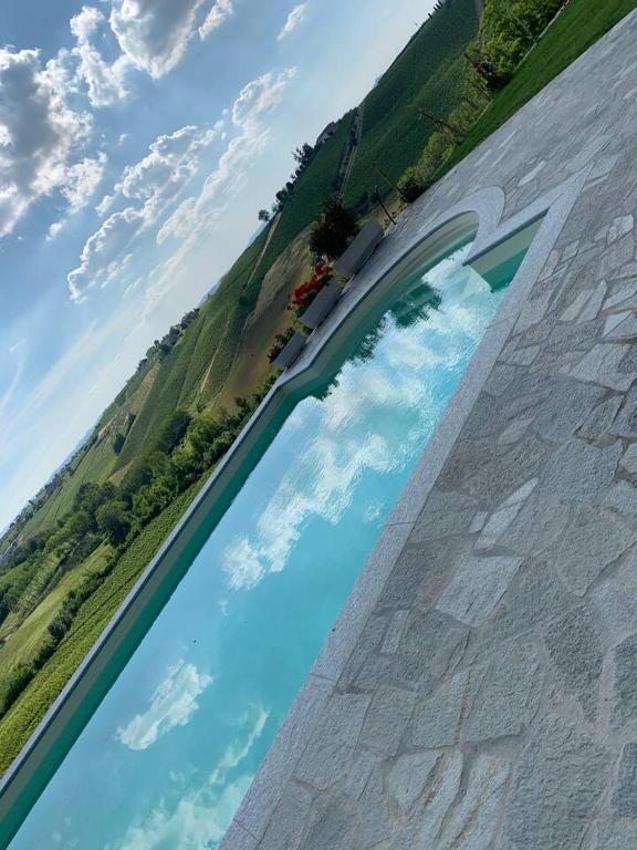 a painting of a river on the side of a building at Villa Corleone in Nizza Monferrato