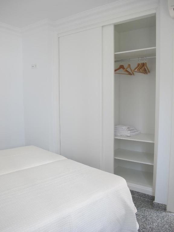 Posteľ alebo postele v izbe v ubytovaní Apartamentos Jimmy 2