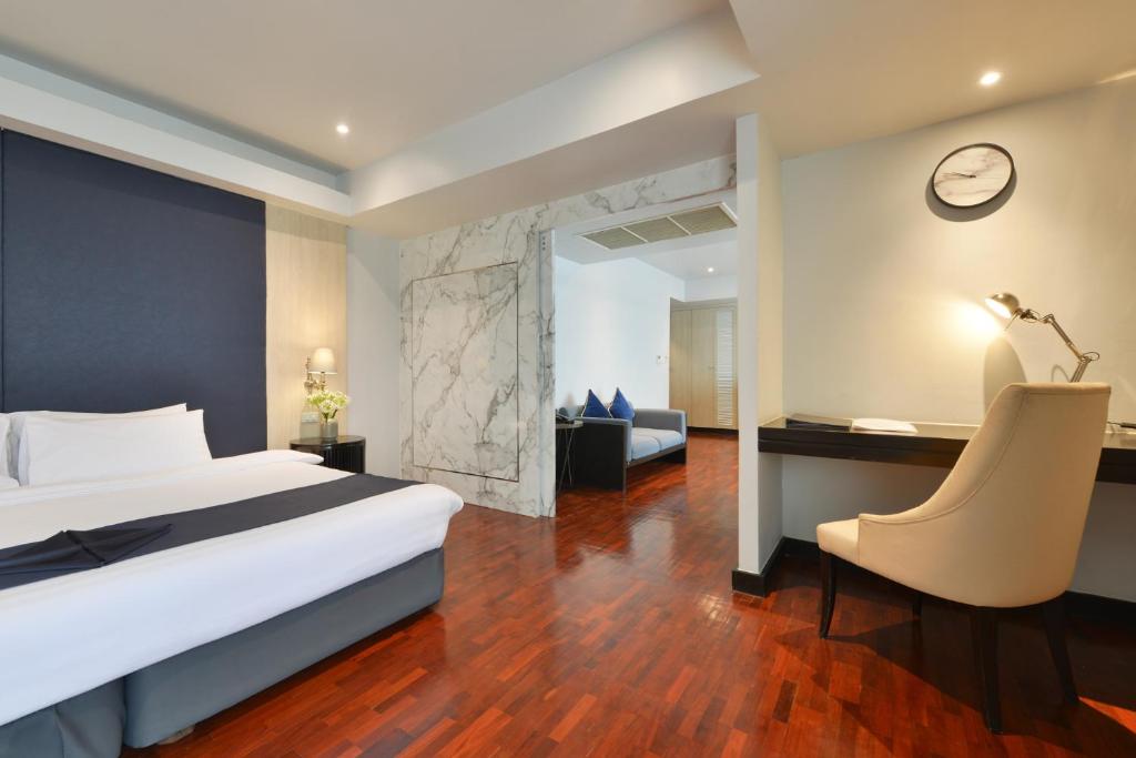 A bedroom corner with a built-in writing desk beside the bed.