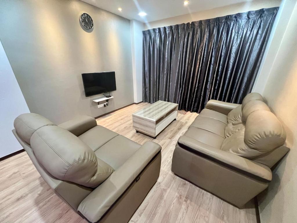 Χώρος καθιστικού στο Kozai Cozy Homestay