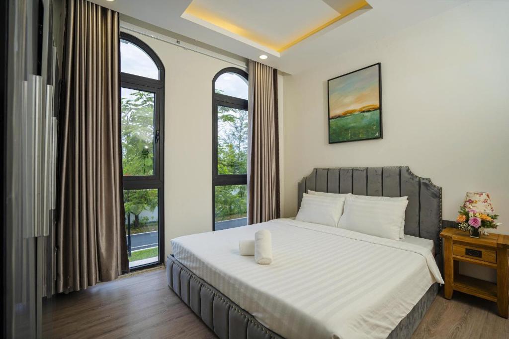 Postel nebo postele na pokoji v ubytování LA Homestay - Lá's House