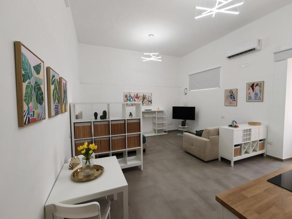 a living room with a couch and a table at Pepè Loft in Salerno
