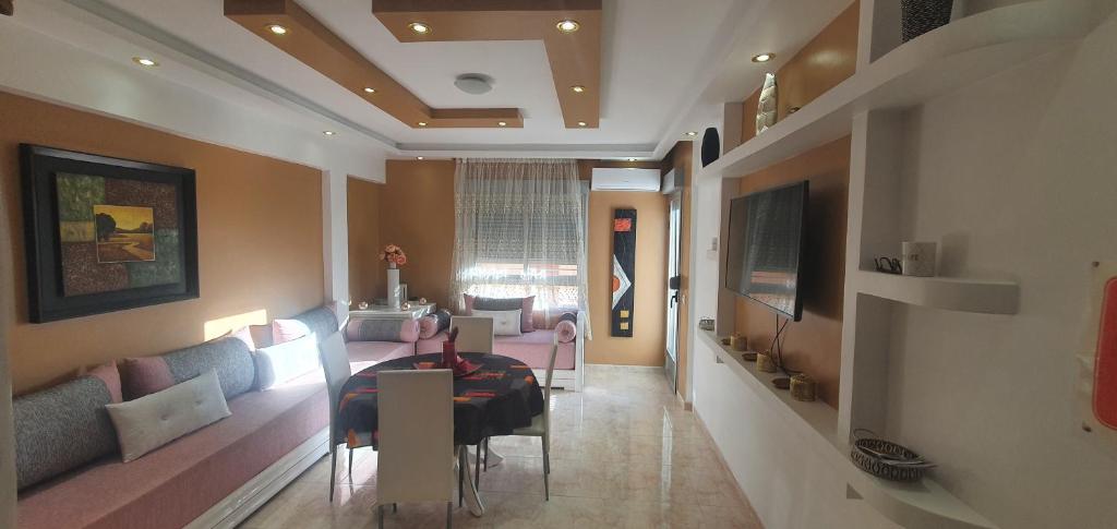 Μια τηλεόραση ή/και κέντρο ψυχαγωγίας στο Appartement charmant rénové à neuf à El Grao di Castellon de la plana