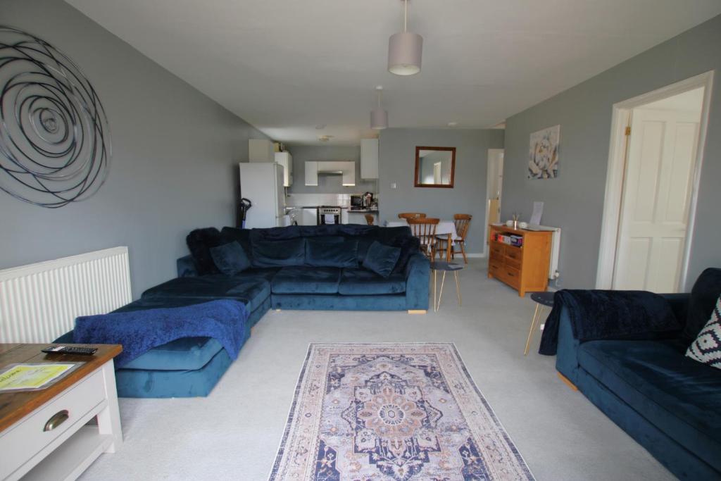 a living room with blue couches and a table at Saddlebrook 284 in Warden