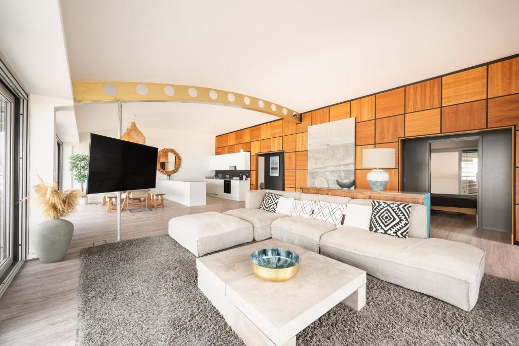 Μια τηλεόραση ή/και κέντρο ψυχαγωγίας στο Amazing beach apartment