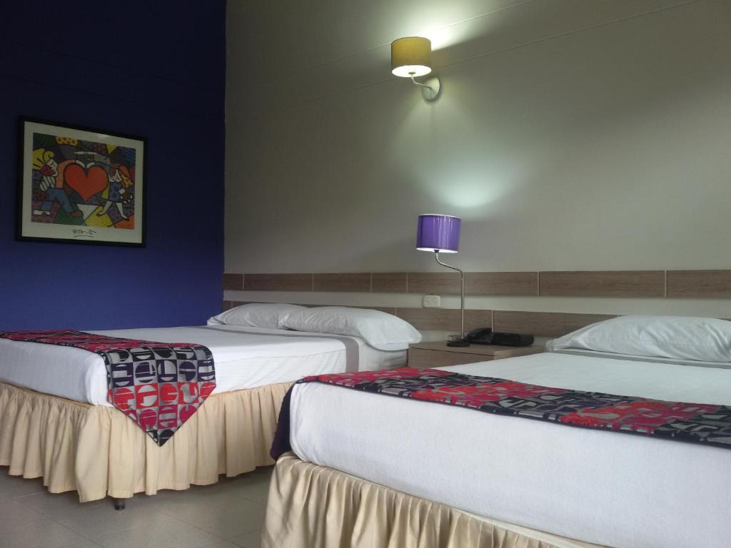 Postel nebo postele na pokoji v ubytování Hotel el Tesoro
