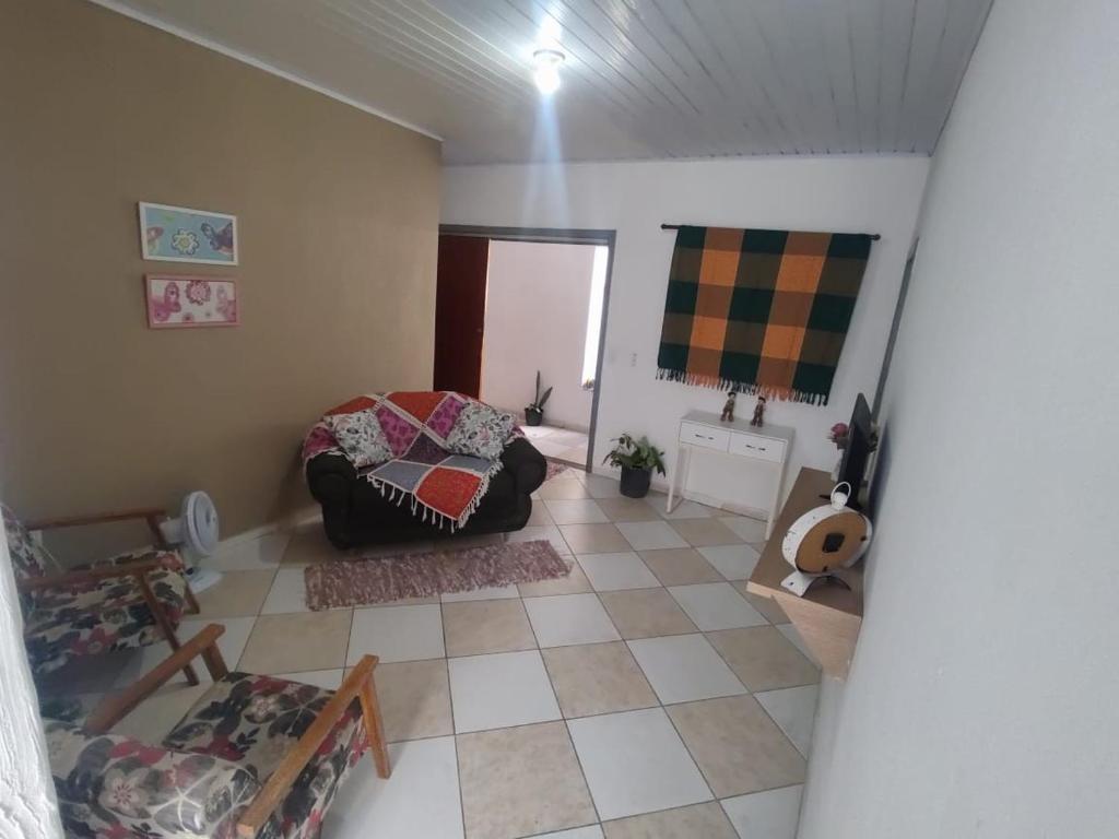 Ένα ή περισσότερα κρεβάτια σε δωμάτιο στο Perfeita Harmonia Residence