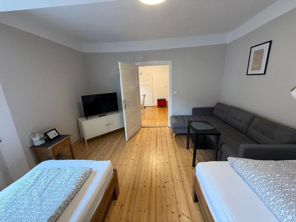 a living room with two beds and a couch at Landidyll am Knüll in Alheim