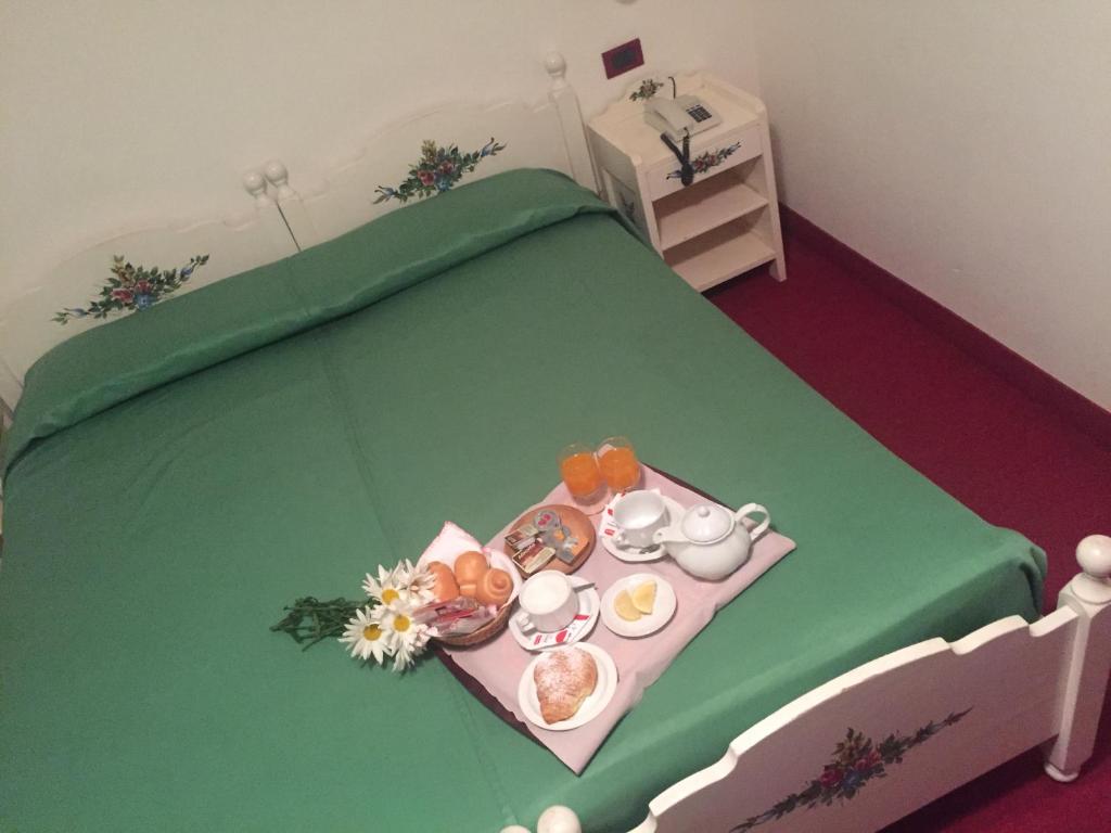 Postel nebo postele na pokoji v ubytování Hotel Tosa