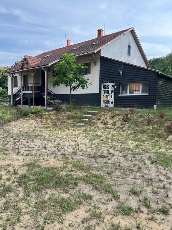 a house with a large yard in front of it at PusztaHaus Pusztavám in Mór