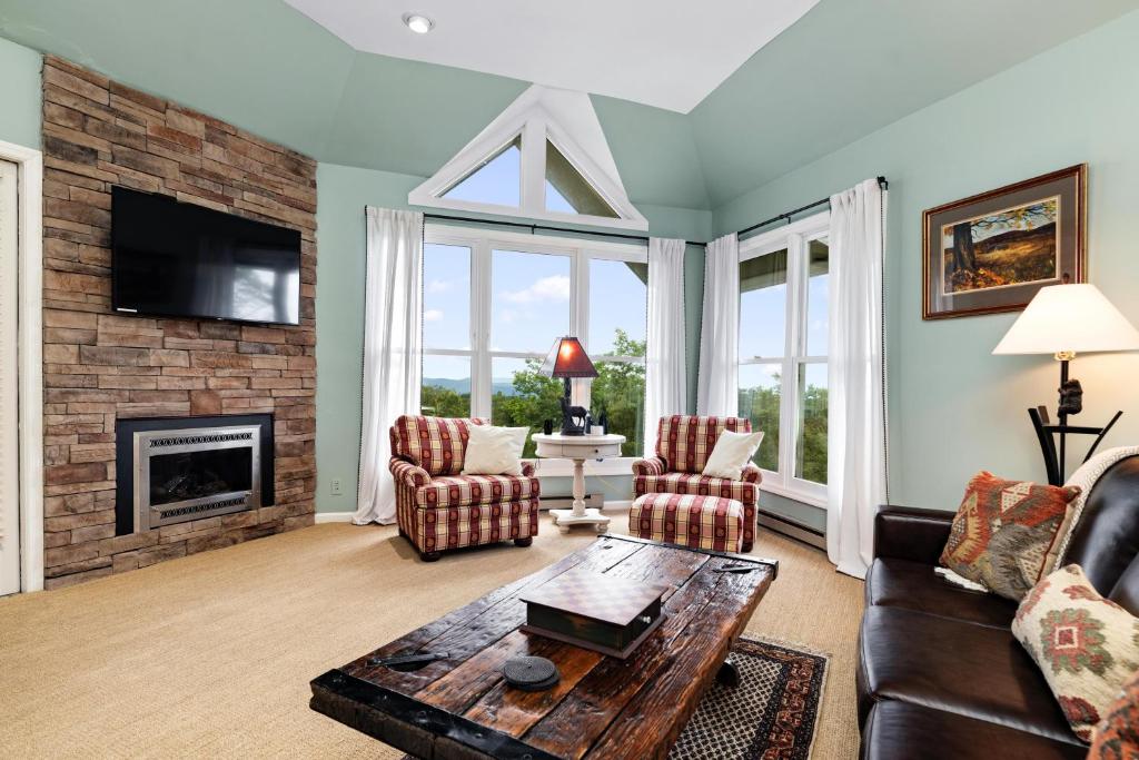 a living room with a couch and a fireplace at Shenandoah Ridge 05 with Wintergreen Advantage in Wintergreen