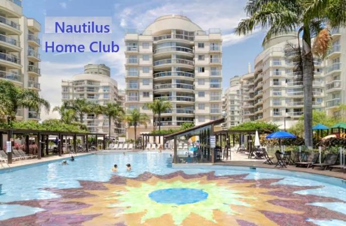 a large swimming pool in a resort with buildings at Nautilus Apto Beiramar Churrasqueira Piscina Beto Carrero in Penha