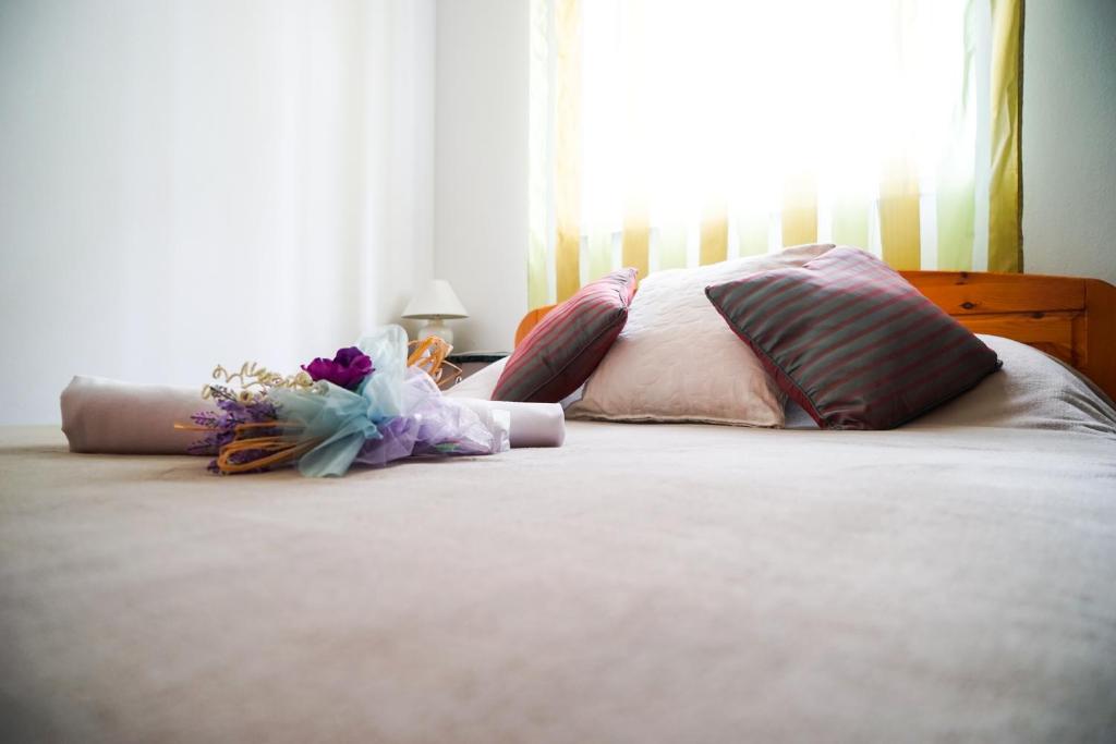 Postel nebo postele na pokoji v ubytování Floral Apartment