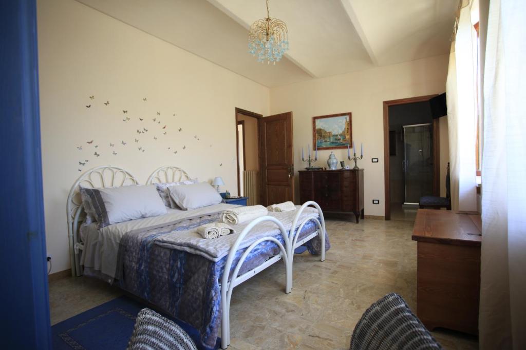 Postel nebo postele na pokoji v ubytování Al Canei B&B