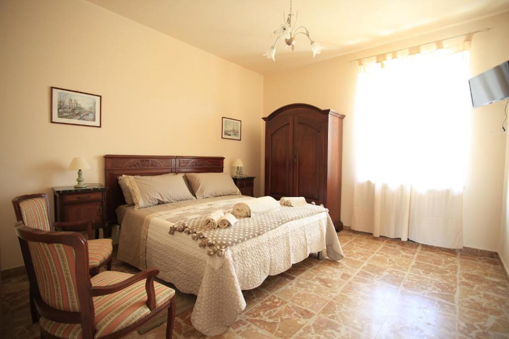 Postel nebo postele na pokoji v ubytování Al Canei B&B