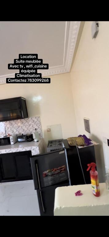 Dapur atau dapur kecil di Suite meublée