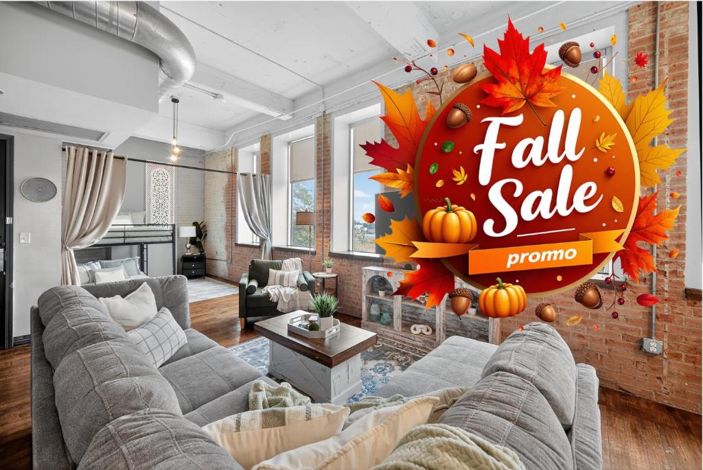 a living room with a fall sale sign on the wall at Haven 326 2bd Loft Sleeps 10 Free Parking in Dallas