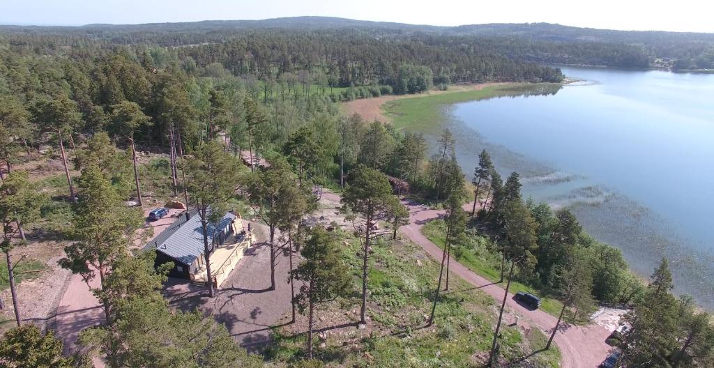 an aerial view of a house next to a lake at Finn&ouml; Stugby in Geta