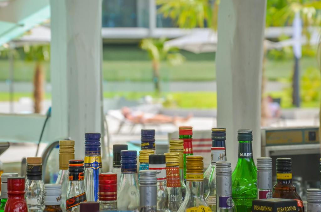 a group of glass bottles sitting on a table at Thassos Imperial Resort in Skala Rachoniou
