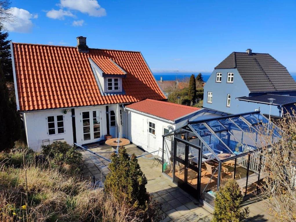 an aerial view of a house and a greenhouse at 6736-Allinge-Thorkildsvej-8 in Allinge