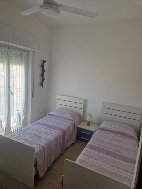 Giường trong phòng chung tại La casa dei Limoni