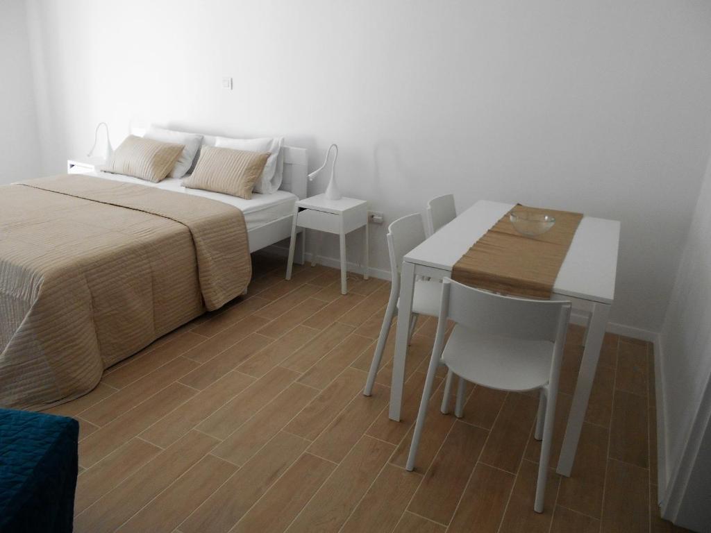Postel nebo postele na pokoji v ubytování Apartments Kaldana