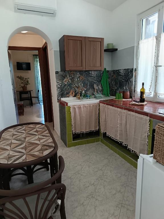 a kitchen with a table and a counter top at Ape Regina in Nerola