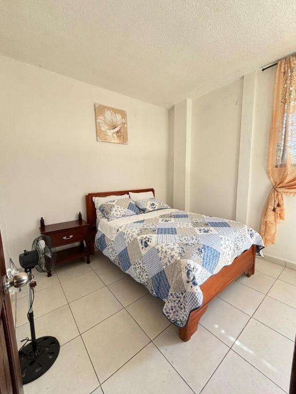 a bedroom with a bed and a camera in it at casa del sol in Tena
